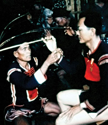 Captain Truong receives his copper bracelet.