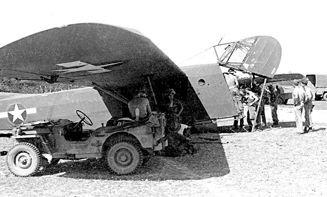 The CG-4A Waco glider was the basic U.S. Army glider of WWII. This example, being loaded by OSS Detachment 101 in Burma, has the nose flipped open to allow easier access.