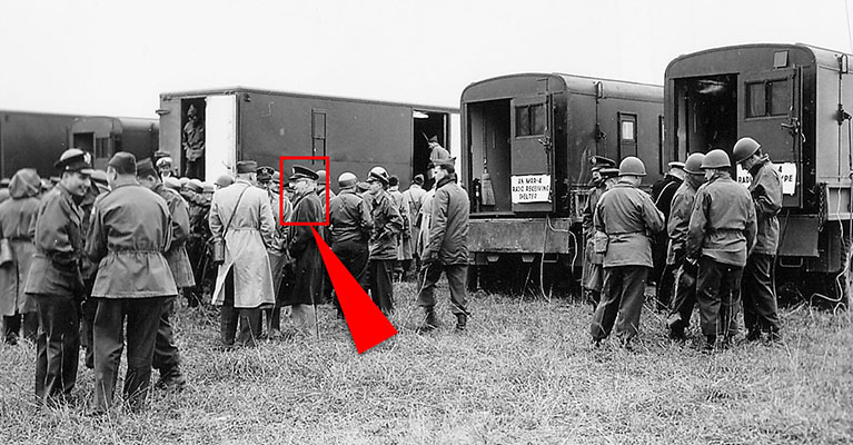 The mobile radio station at Fort Riley: During the graduation of PSYWAR Class #1 the mobile radio station was set up for visiting dignitaries. This was the prototype system. It would take a few months to produce the systems for the 1st RB&L in Korea. The two vans on the left are production studios; on the right are the radio transmitter and receiver, each mounted in a truck shelter. In the center of the photo are BG McClure, the Chief of PSYWAR (indicated by arrow) and COL Greene, the Chief of PSYWAR for FEC.