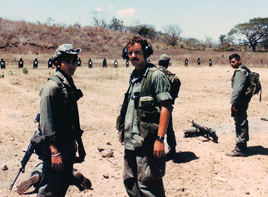 Sergeant Kenneth Beko, wearing ear protectors, during M-16 training for the Ponce Cazadores prior to the 25 March 1984 election.