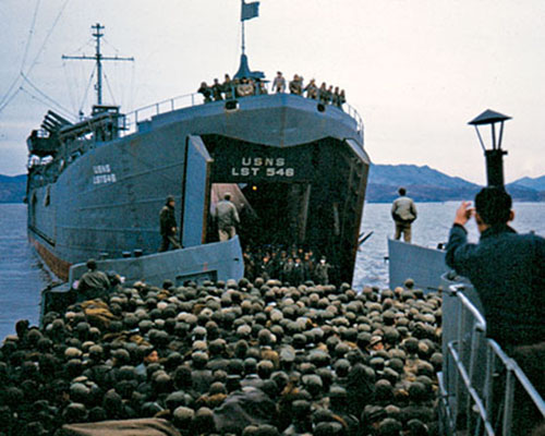 Partisans of WOLFPACK loading USNS 548 Landing Ship Tank (LST). The partisans were relocated to Cheju-do and inducted into the ROK army.