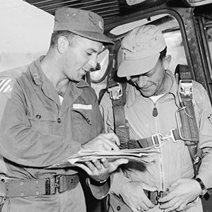 CPT Leonard Kleckner briefs L-19 pilot 1LT Albert D. Ackley