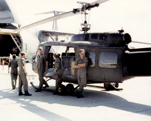 245th personnel waiting to load a UH-1H on board an Air Force C-5A Galaxy