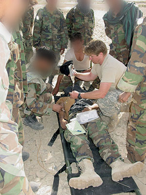 >A Special Forces medic treats a wounded team member.