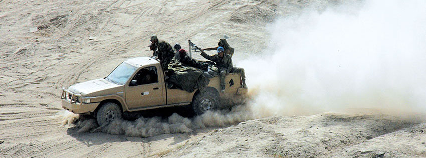 Afghan National Army troops in a Ford Ranger pickup.