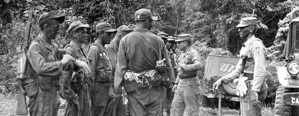 CPT Richard Carvell evaluates the preparations of the Salvadoran Ranger students before their reconnaissance patrols to Piña Beach.