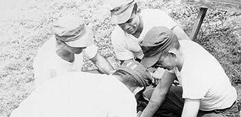 Salvadoran Ranger students practice splinting a broken leg during First Aid training at Fort Gulick.
