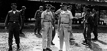 USARSO commander, MG T.F. Bogart, visited CPT Richard Carvell and ODA-3 on Banana Island in Gatun Lake where the Salvadorans were receiving Ranger training. CPT Iraheta is at the far left.