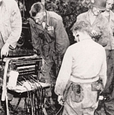 Wire communications between a headquarters and its subordinate units were the most secure method of transmission. The communications section of Merrill’s Marauders HQ established a switchboard to handle traffic  with battalions in Burma during World War II.