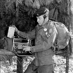 A field communications station at Fort Bragg in the 1960s using a commercial shortwave radio.  This is in the Special Forces Gabriel Demonstration area on Smoke Bomb Hill.  The Gabriel demonstration was an active display of Special Forces’ capabilities.