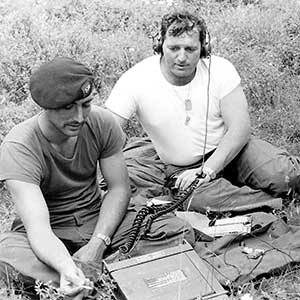 Special Forces soldiers at Fort Bragg transmitting using the AN/PRC-74 HF radio.  The RTO is sending a message in Morse Code.