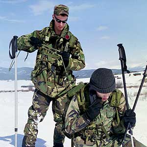 Members of the  10th Special Forces Group establish  communications  during winter  training in Colorado.  Powerful lightweight,  Multiband Intra-Team Radios (MBITR) were  developed in the 1990s to support  ARSOF missions.