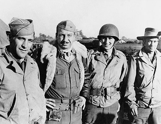 T/5 Melbourne L. Rackett, USN Warrant Officer Robert R. Rhea, T/5 Thomas N. Moon, and agent “King” somewhere in Burma, early 1944. Rhea, a photographer for the OSS Field Photo branch, was later assigned to the Marauders and later made an “official” unit member.