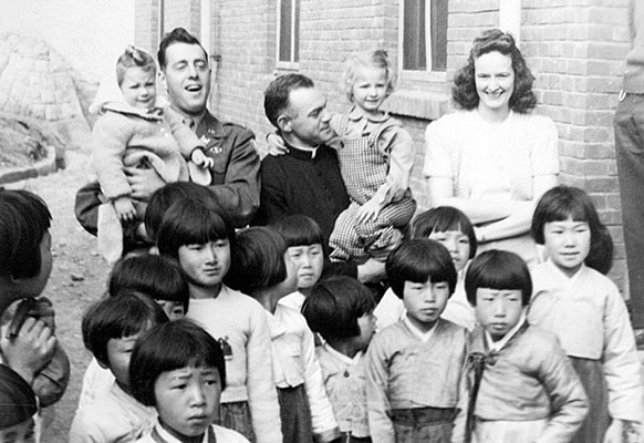 Mokpo Orphans School, 1947. Sheryl Vangen, 1LT Robert Malley, Father Henry, Sharon Vangen, and Mary Vangen.