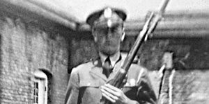 Private Terry A. Vangen in dress uniform and armed with M-1903A1 .30 cal rifle before a guard mount at Fort Snelling, MN.