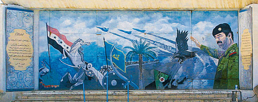 This mural from an airbase near Tikrit with everything from modern jet fighters to Muslim warriors shows “Saddam the Military Leader.”