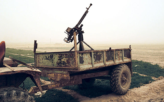 A farm trailer-mounted 12.7mm DShK heavy machinegun in the Cult of Heaven compound. It was hooked up to a tractor.