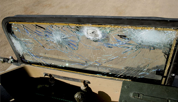 Proof of the effectiveness of ballistic glass mounted on the sides of the TF Raptor GMV cargo areas.