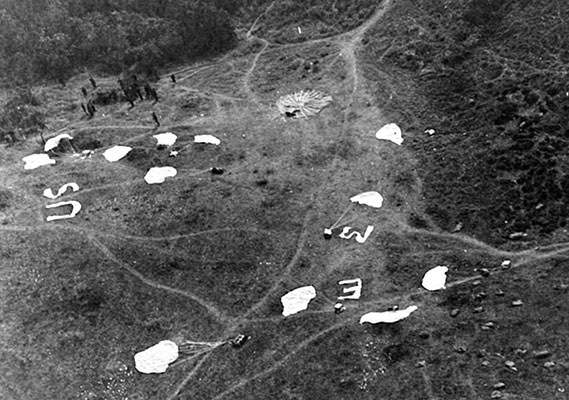 A Detachment 101 drop zone as seen from the air. Notice how parachutes were used as marking panels.
