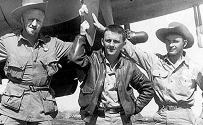 Lieutenants Harry Council, Joe Lazarsky, and Daniel Mudrinich pose by a C-47 in 1943. The photo was taken just prior to Council and Mudrinich being inserted to join the FORWARD group, northeast of Myitkyina.