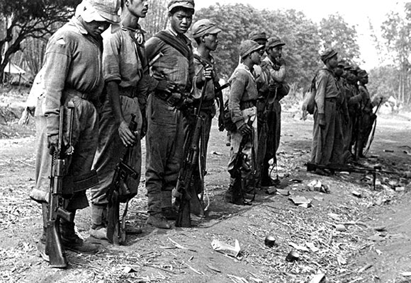 Detachment 101 armed thousands of indigenous  guerrilla troops. Pictured are ethnic Shans near Wan Kat Ping, Burma, April 1945, armed with a variety of weapons: .30-06 caliber Johnson light machineguns, Johnson rifles, .45 caliber Thompson submachineguns, and a .303 caliber Bren gun.