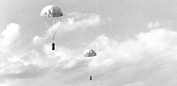 10. Two supply bundles for an OSS Detachment 101 group float to earth in north Burma, 1944.