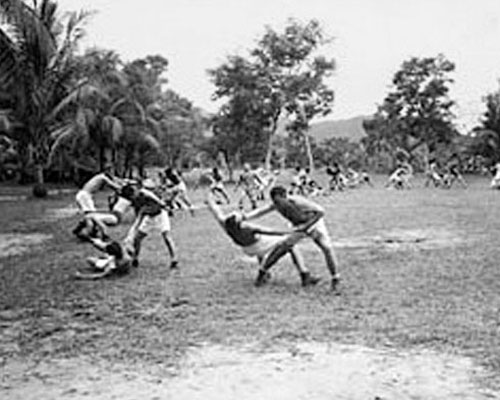 Trainees of ASTC Class #4 at Hollandia, New Guinea were instructed in Ju-Jitsu as part of the physical training program. The training was taught by one of the few Americans qualified in this form of martial arts.