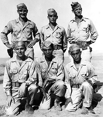 Nellist Team after the Oransbari Rescue mission. Pictured: Andy E. Smith, Galen C. Kittleson, William E. Nellist, kneeling, Wilbert C. Wismer, Sabas A. Asis and Thomas A. Siason. Taken New Years Day, 1945 on Leyte, Philippine Islands.