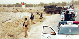 Hilla SWAT police join 2nd Battalion, 3rd Infantry Regiment Stryker task force to clear the enemy compound on 29 January 2008.