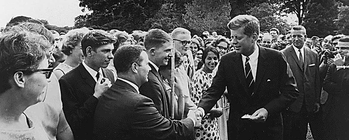 President John F. Kennedy greets the first Peace Corps volunteers in Washington, DC, 28 August 1961. The Peace Corps was his initiative and between 1962 and 1967, 16,000 volunteers were sent to Latin America.
