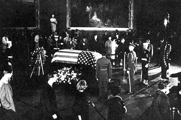 President Kennedy was assassinated in Dallas, TX, on 22 November 1963 by Lee Harvey Oswald. The death of the youthful and popular President shocked America.
