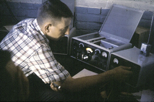 SFC Tom Carpenter, Heavy Weapons Sergeant, calls Panama on the Collins KWM2A commercial single sideband radio.