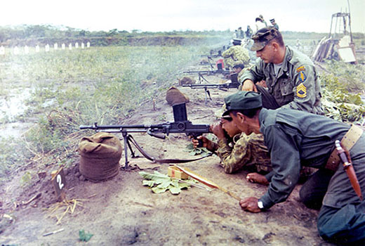 The Czechoslovakian ZB-30 7.92 mm light machine gun was used until replaced by the U.S. .30 caliber M-1919A6. Sergeant First Class Harold T. Carpenter instructs a Bolivian gunner during the deployment of the Mobile Training Team BL 404-67X.