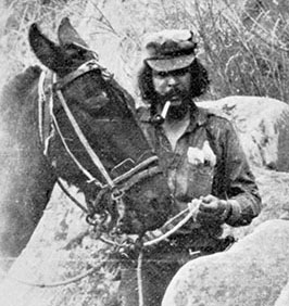 Che poses with his mule Chico in September 1967. Ill from the effects of asthma and malnutrition he could no longer endure the pace and had to ride to keep up with the vanguard.