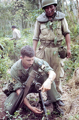 SSG James A. Hapka, a medical specialist instructs on the M2 60 mm mortar.