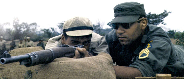 SSG Wendell Thompson checks the weapon positioning of a left-handed Bolivian Ranger firing a 7.62 Mauser.