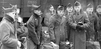 Private Frank Jaks and his Lodge Act compatriots ready to load the train for Bremerhaven.