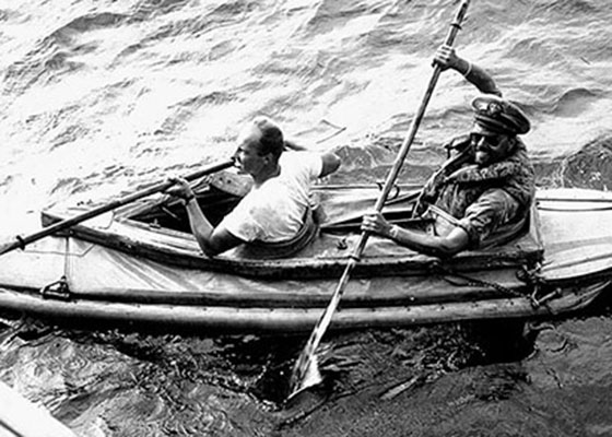 Lieutenant John E. Babb, USN, and Chief Petty Officer Herman J. Becker, USCG, kayaked to the island after the OGs landed to gather beach samples. Seen here returning to P-564, they are using a British kayak because the OSS versions failed to arrive in the Arakan.