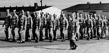 Franciszek Kokosza and his Lodge Act group marching at Fort Devens, Massachusetts.