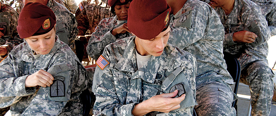 Soldiers replace their USASOC SSI with the new 528th SSI.