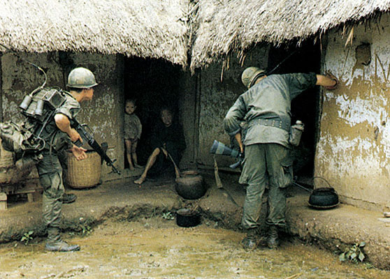Soldiers of the 1st Cavalry Division search a village in October 1966 during Operation IRVING.