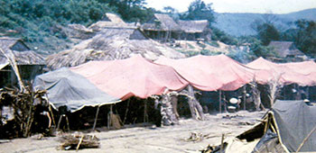 Newly-relocated civilians lived in primitive housing (as evidenced by the tarps). One mission of the 41st CA was to help provide better housing.