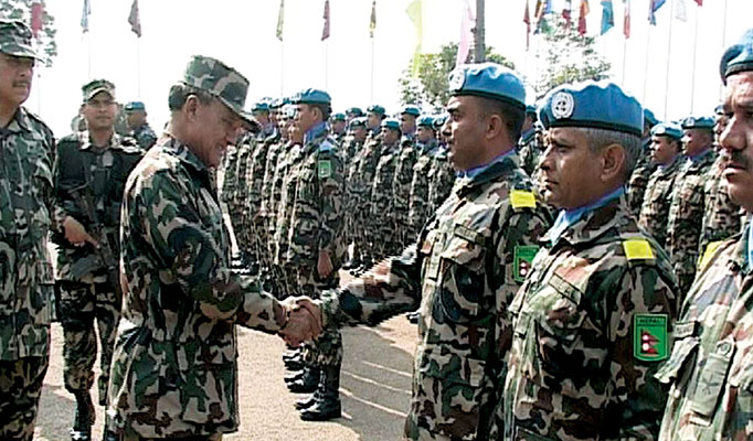The Chief of Staff of the Nepalese Army inspects a contingent of troops prior to their deployment for UN service in Bosnia. The Nepalese Army has been supporting UN operations since 1958.