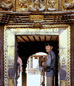 A member of the Royal Guard Brigade on duty at one of the entrances to the palace complex. In 1995, the Nepalese Army numbered 46,000, with a brigade dedicated to guarding the Royal Family.