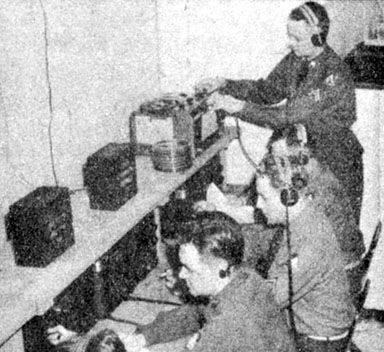 5021st Psywar Detachment interpreters and linguists monitor international radio broadcasts at Camp Forsyth, KS.