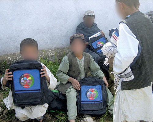 The school supplies provided by the CA team included bookbags decorated with a message stressing the importance of education to the future of Afghanistan.
