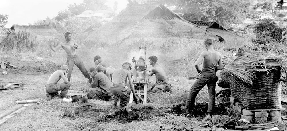 1st Section, C Battery, 612th Field Artillery fires at Japanese positions near the Burma Road, 19 January 1945.