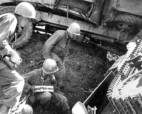 To prevent the Japanese from recovering their stranded vehicles during the night, patrols used explosive charges to destroy the enemy equipment.