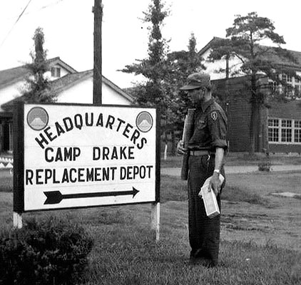 Sign indicating the location of the Far East Command (FECOM) Replacement Detachment at Camp Drake, Japan.