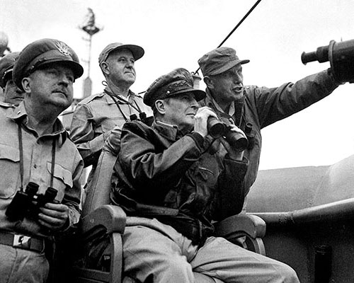 General MacArthur watches the bombardment of Inch’on from the bridge of the USS Mount McKinley with MG E.K. Wright, Vice Admiral A.D. Struble, and MG Edward M. Almond, X Corps commander.